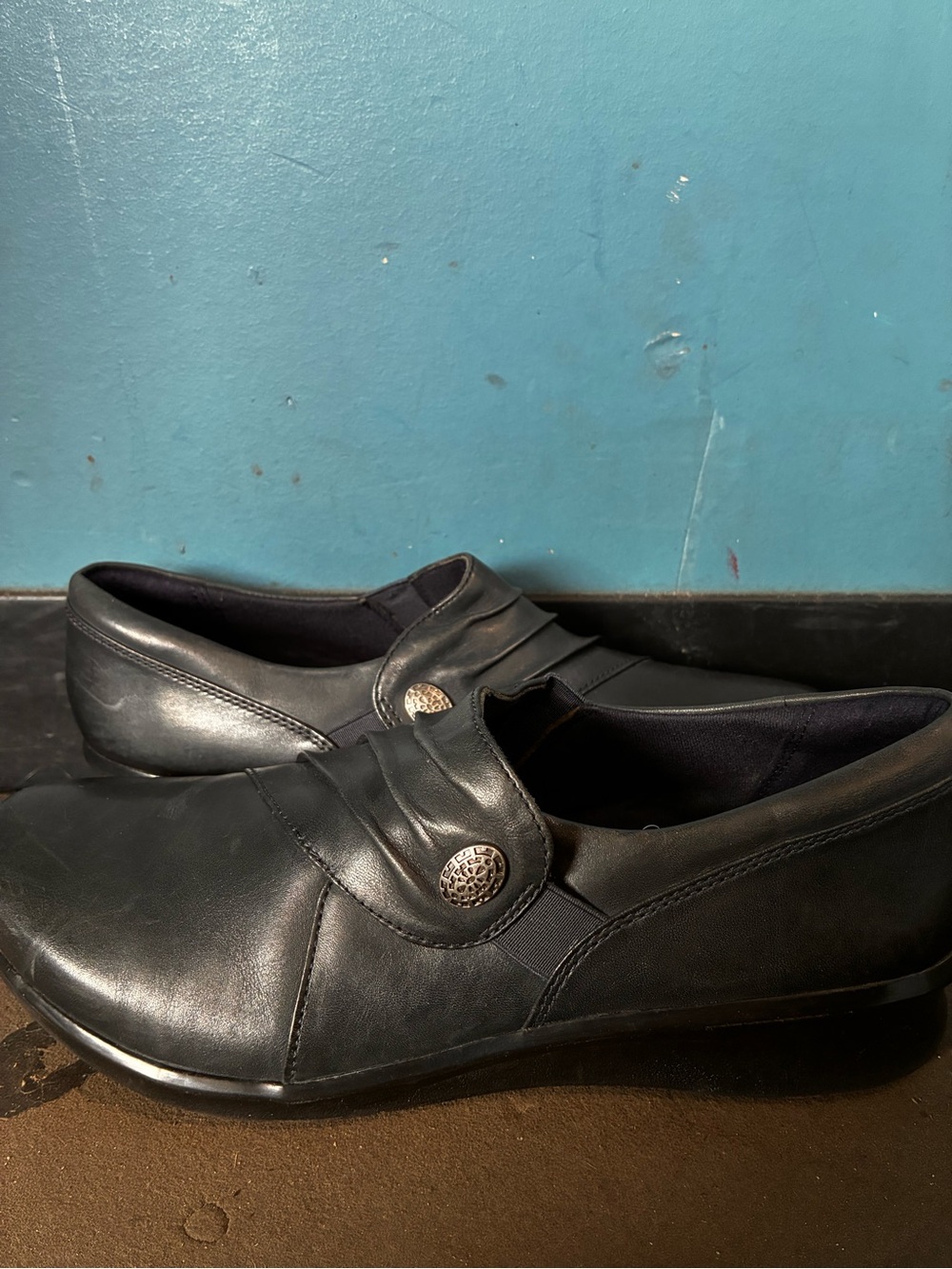 Clarks Black Leather Slip-On Loafers with Decorative Medallion